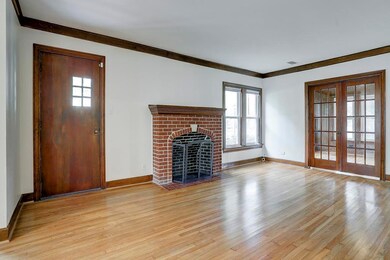 Living room with access to study through double doors. Hardwood floors throughout.