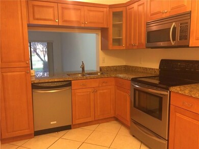 Updated kitchen with granite countertops and stain
