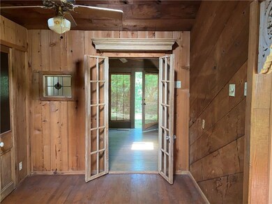 Glass French Doors with molding detail between Foy