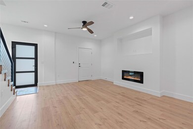 Unfurnished living room featuring light wood-styl