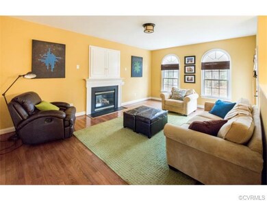 Family room with gas fireplace and built-in cabine