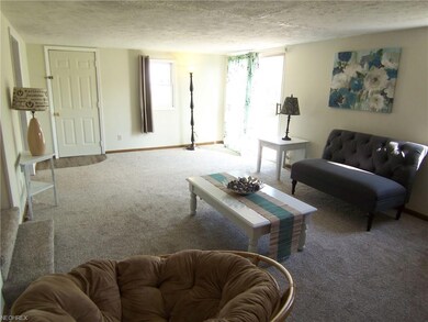 Livingroom angle 3.  Sliders to back deck.  Home i