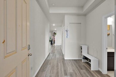 Inviting front entry with a wide hallway and styli