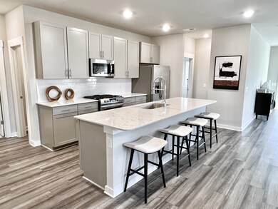 Beautiful cabinets and stainless appliances. Large island with quartz countertops included