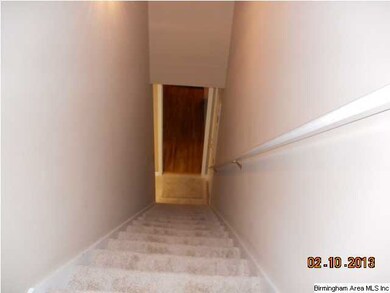 steps to the bonus room off the kitchen hallway