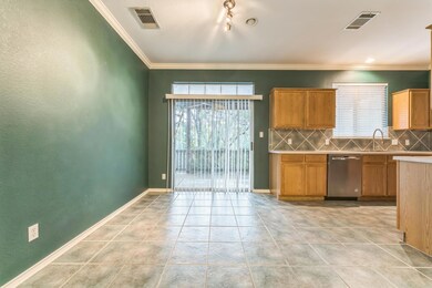 Kitchen featuring stainless steel dishwasher, tas