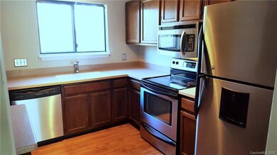 Gorgeous kitchen with wood floors and stainless ap