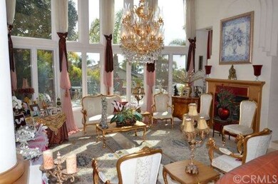 living room with fire place and soaring windows