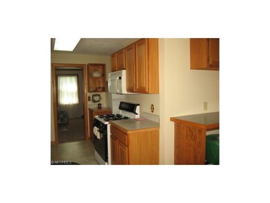 KITCHEN TO LIV RM VIEW - 1/2 BATH ADJACENT BEHIND 