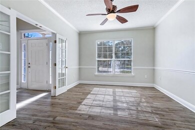 Formal dining room with French doors leading into