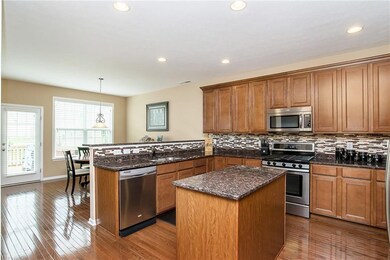 Amazing kitchen with granite counter tops, breakfast bar, & center island!
