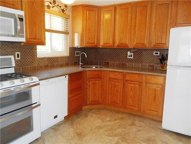Open and spacious with a tiled back splash and gra