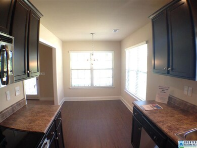 Kitchen has eat in dining that over looks the rear