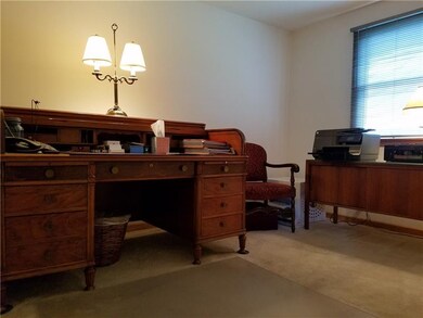 Den/office with closet and door for privacy.
