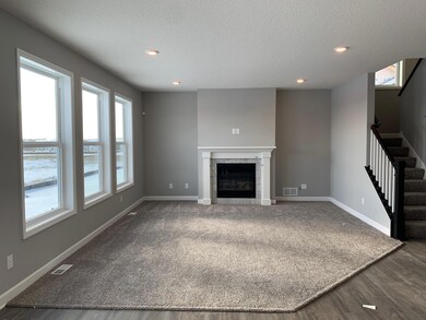 Notice the stunning natural light pouring into the family room.
