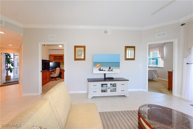 Living area with ornamental molding, visible vents