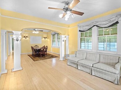 Living room looking into dining room with original