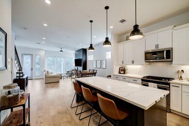 Alternate view of the kitchen shown open to the li