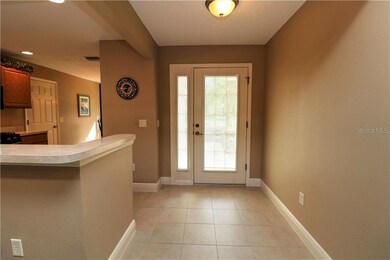 Entrance Foyer with Decorative Glass Door and Tile