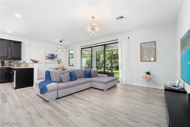 Living room featuring an inviting chandelier and l