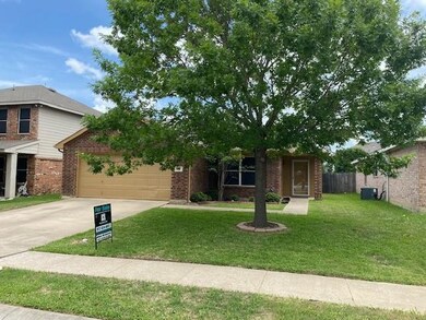 Front of home, landscaped yard, nice curb appeal.