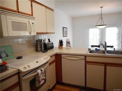The kitchen overlooks the dining area...