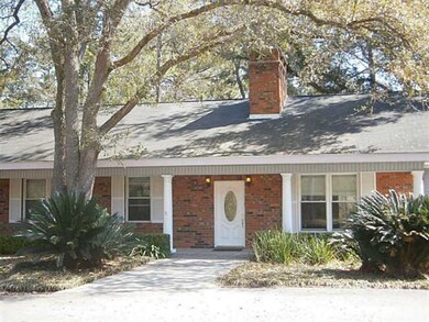 Photo. Welcoming covered front porch with landscap