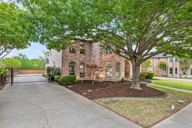 Left side view of driveway with gated iron fence