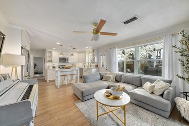 The living room opens to the kitchen & offers a gr
