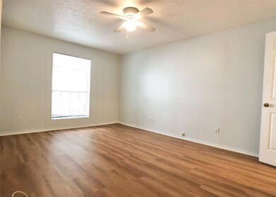 Spare room featuring baseboards, a textured ceili