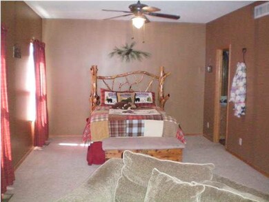 THE 27' LONG MASTER BEDROOM IS A RESPITE FROM THE 