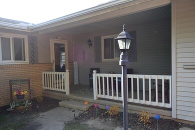 The front entrance is located off of the covered front porch.  The perfect spot for welcoming family and friends into the home.
