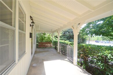 Covered front porch with swing.