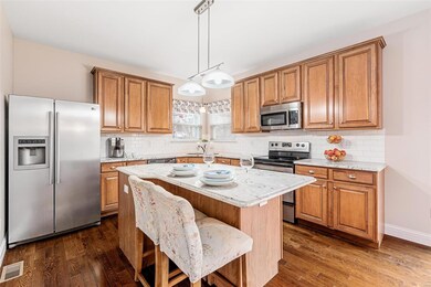 Breakfast bar island, granite counters, and subway tile backsplash!