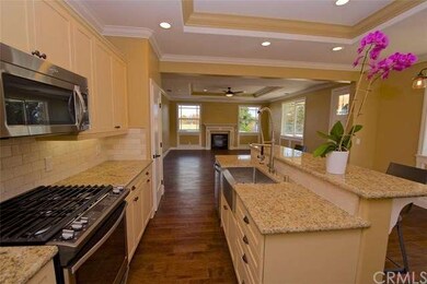 Kitchen includes: slab granite countertops, tumble
