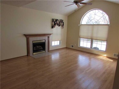 Living Room. LIVING ROOM FEATURE A BEAUTIFUL WINDOW AND COZY FIREPLACE