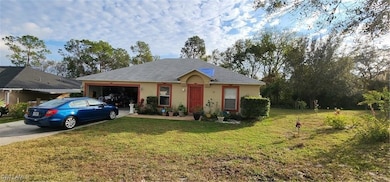 Single story home with concrete driveway, an attac