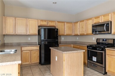 Island Kitchen boasts Granite Countertops, Tile Fl