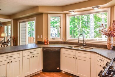 Picture window above the kitchen sink.