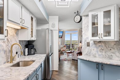 Kitchen with tasteful backsplash, a textured ceili