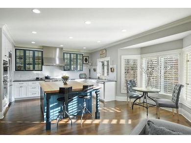 This gourmet kitchen offers custom-built wood fram