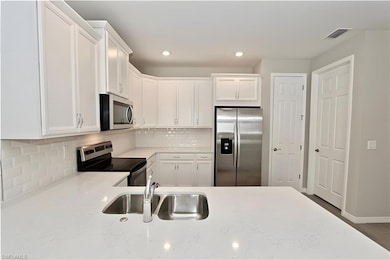 Kitchen with appliances with stainless steel finis