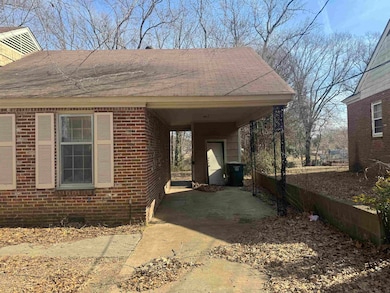 View of front facade featuring a carport