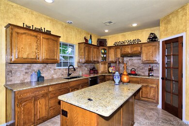 Spacious Kitchen with New Faucet, Black Granite Co