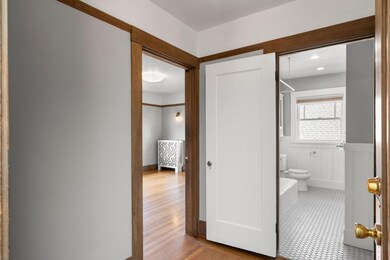 Entry hall with bedroom to left and bathroom strai
