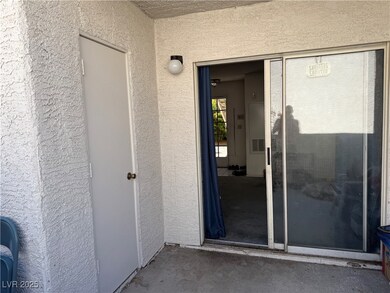 Property entrance with stucco siding