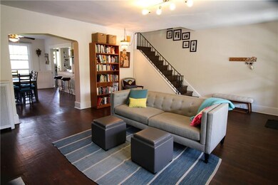 Living room open into dining room and kitchen