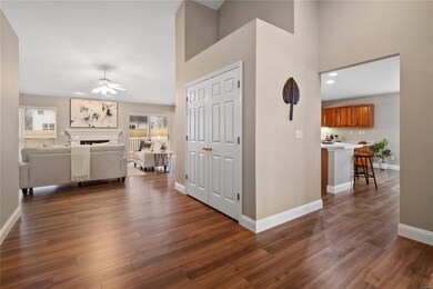 Entry foyer leads to family room with vaulted ceil