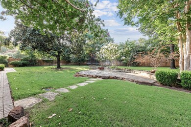 There is plenty of room in the leafy backyard for games, gardening, entertaining or just relaxing with a book