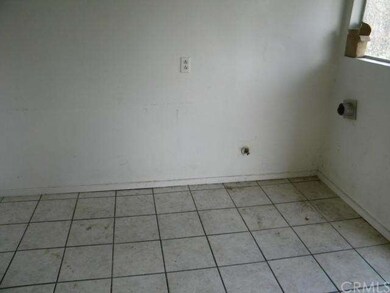 Laundry area is in the kitchen.